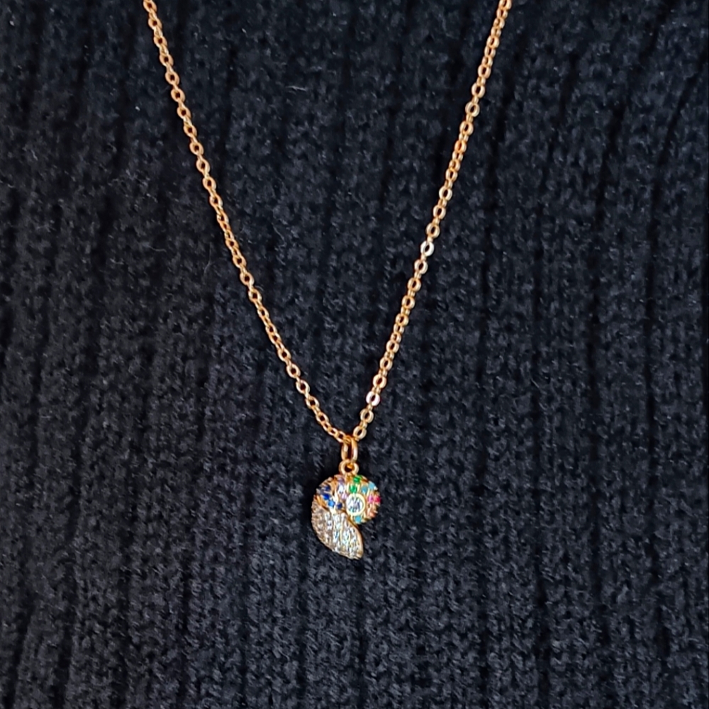 Beautiful gold pavé nautilus shell necklace!